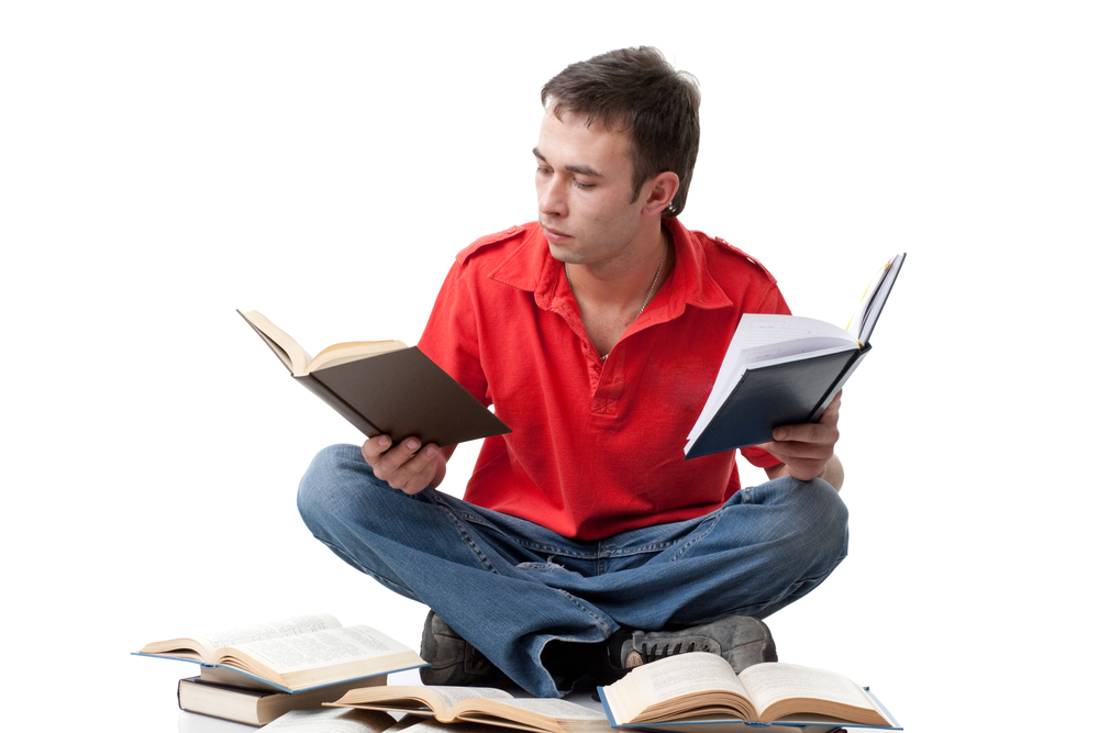 man reading books